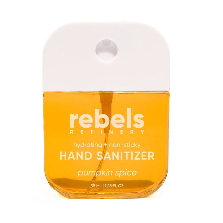 A small bottle of Rebels Refinery pumpkin spice hand sanitizer with a white cap and orange liquid inside, shown on a plain white background.